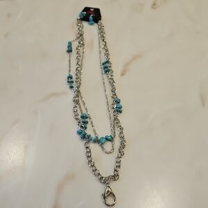 Paparazzi Silver Necklace and earrings with Blue Accents.